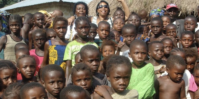 Pearl Jarrett with children in The Gambia on the foundation’s first mission