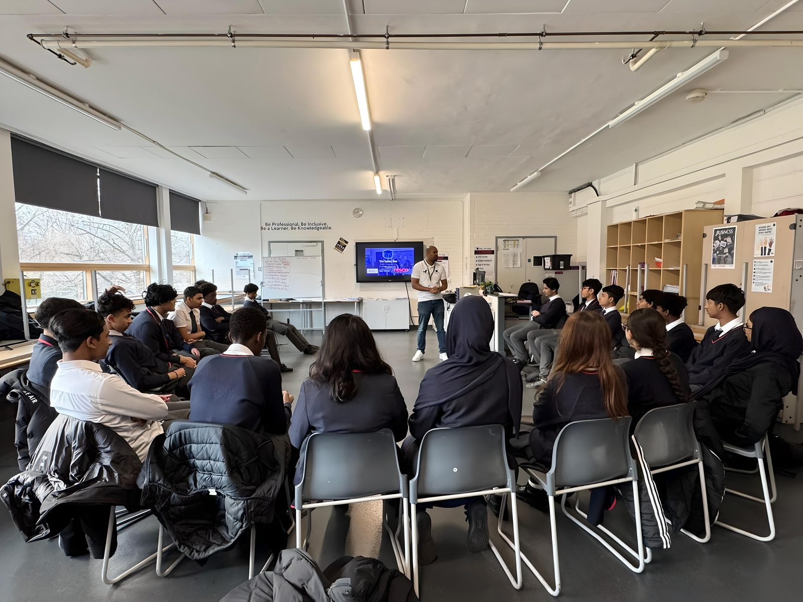 Students seated in a circle during a One Decision workshop in a London school
